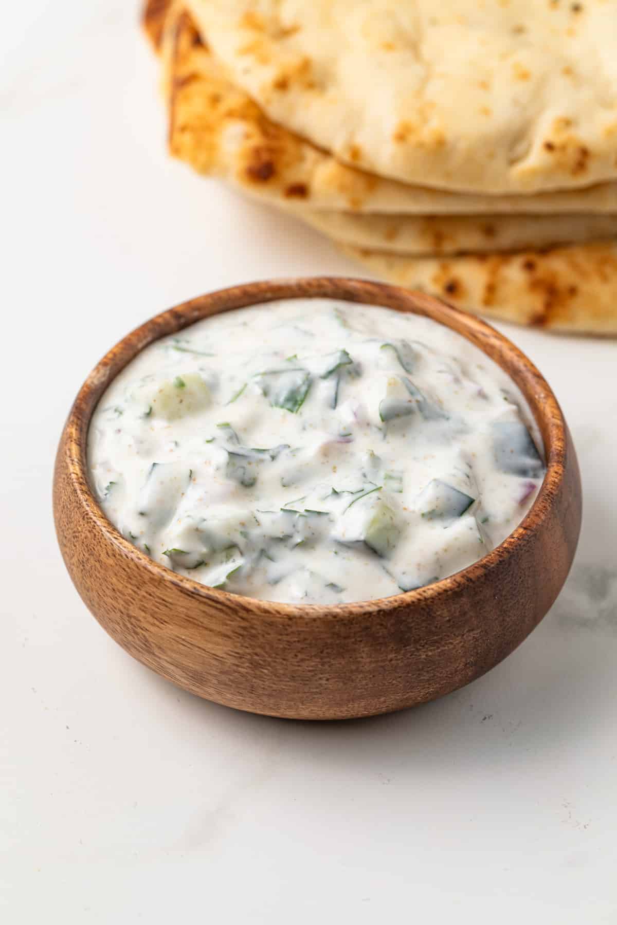 Indian Raita in a brown bowl.