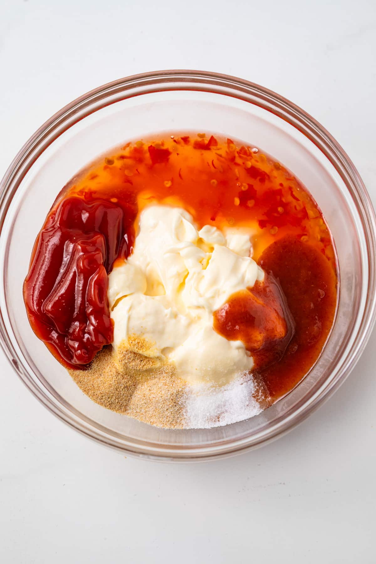 Ingredients combined in glass bowl.