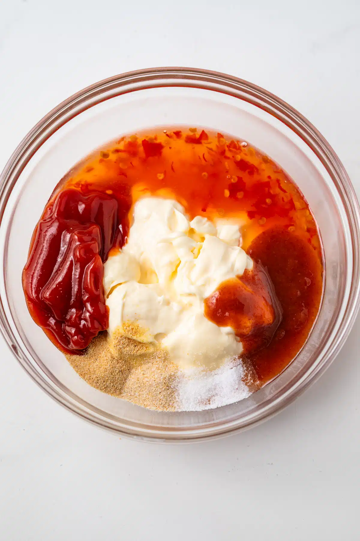 Ingredients combined in glass bowl.