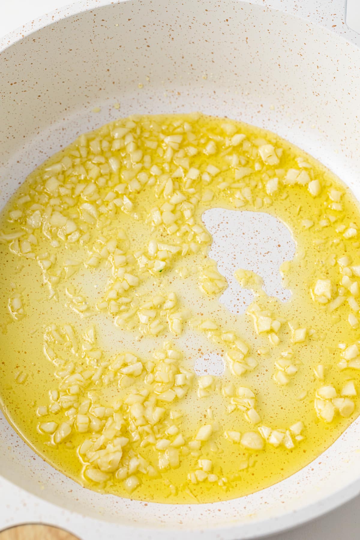 Sauteed garlic in a pan.