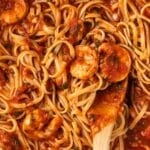 Overhead of Fra Diavolo sauce with pasta and shrimp.