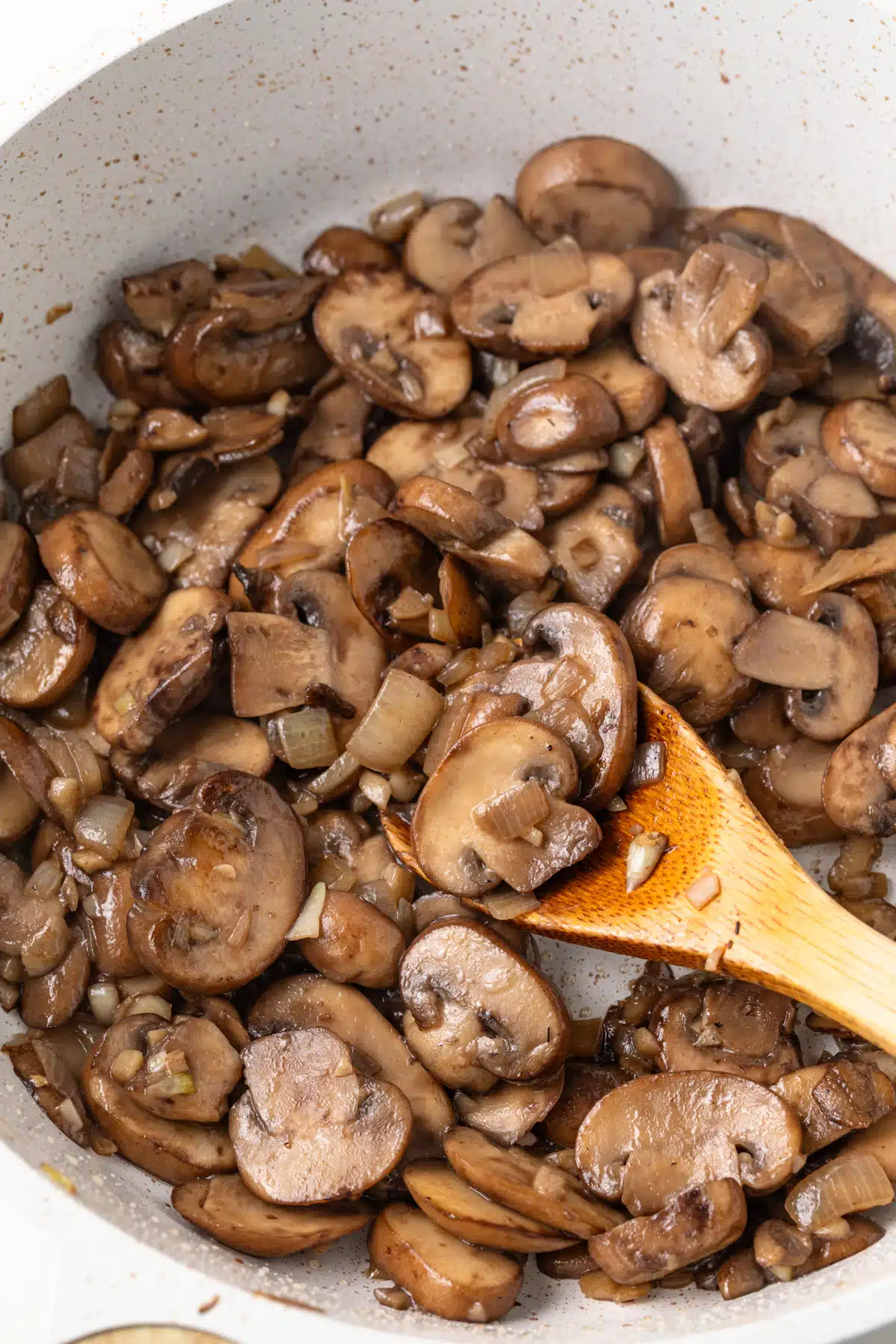 Sauteed mushrooms in a pan.