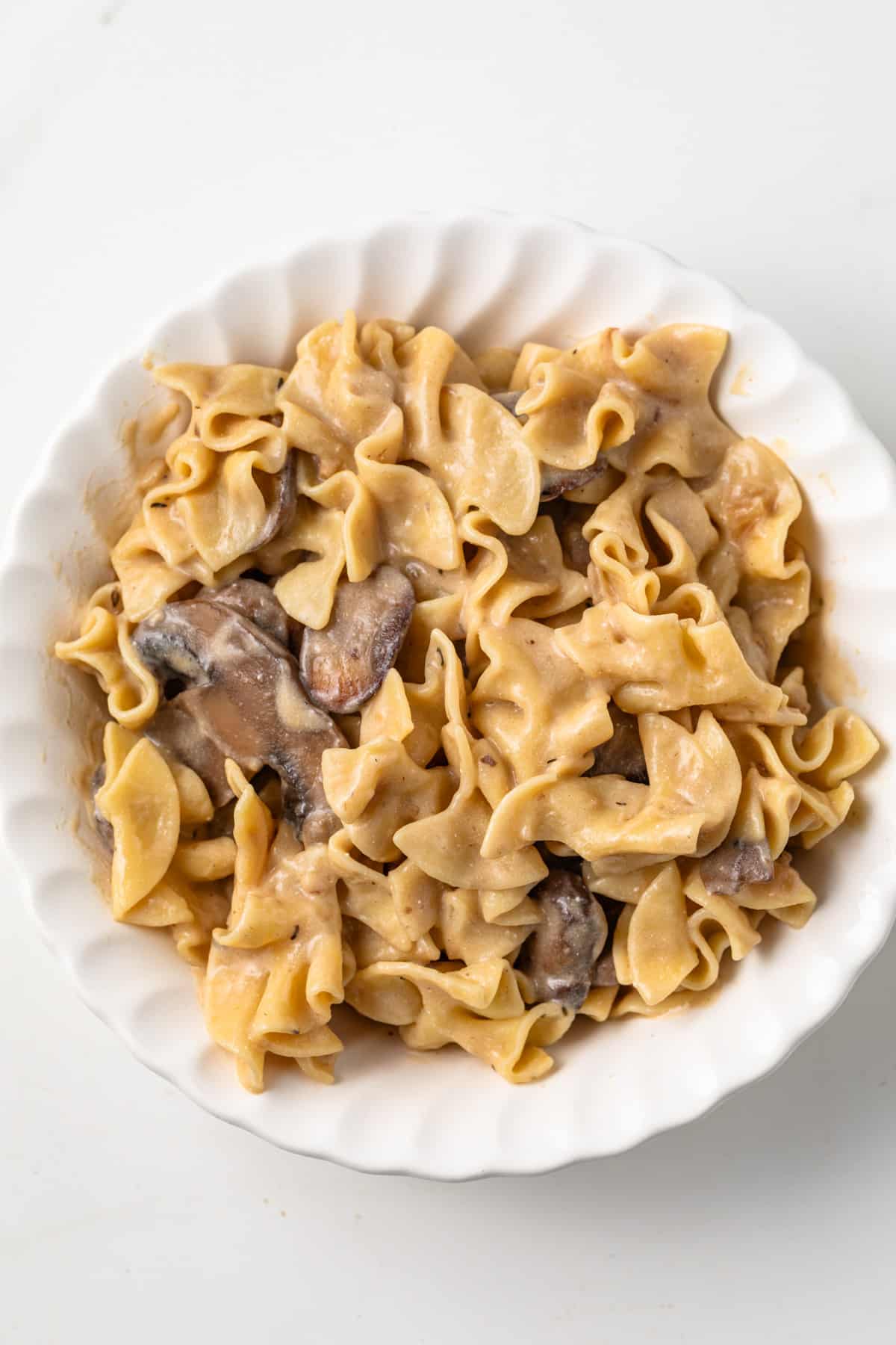 Mushroom stroganoff in a white bowl.