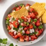 Overhead of Pico de Gallo in a bowl with tortilla chips.