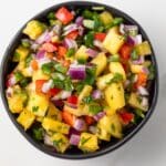 Overhead view of pineapple salsa in a bowl.