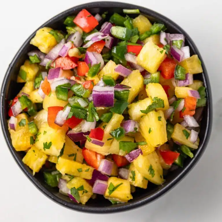 Overhead view of pineapple salsa in a bowl.