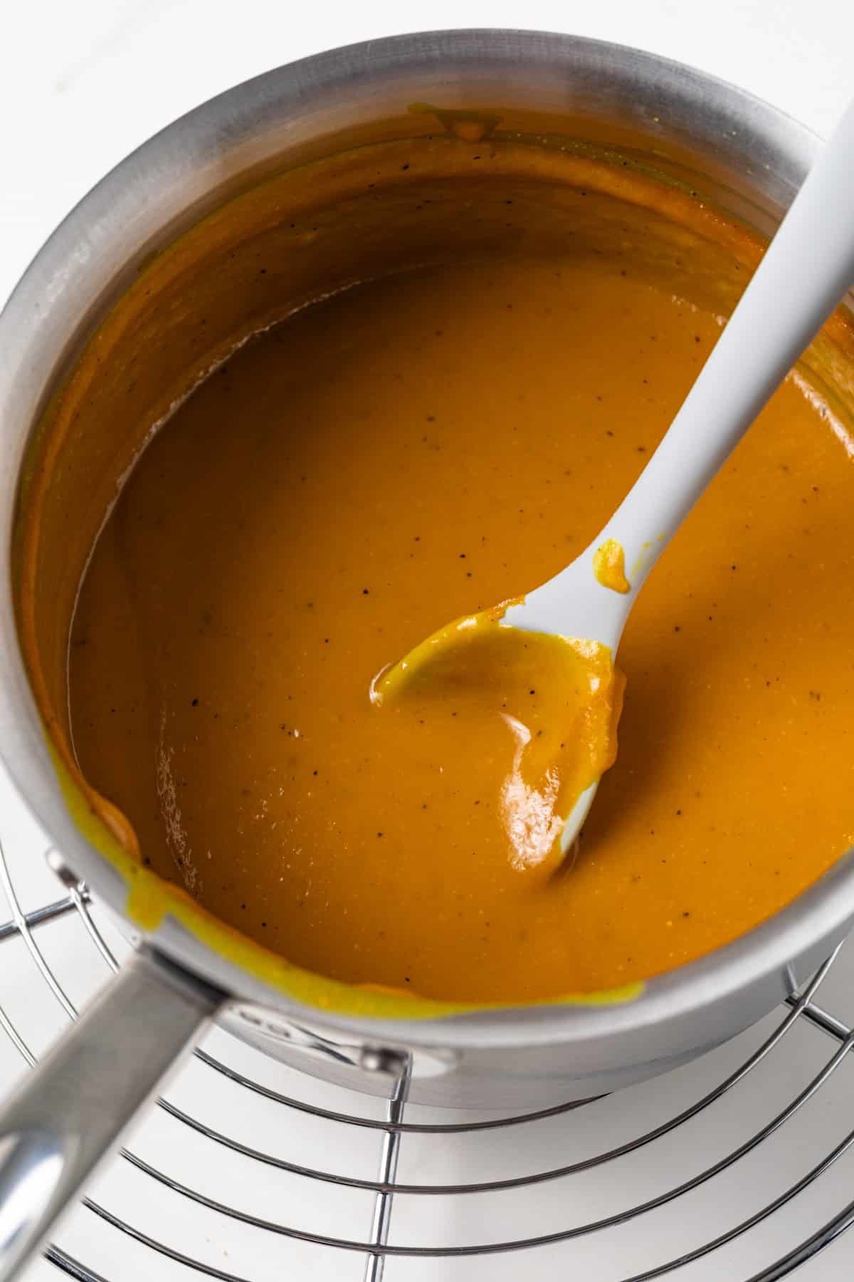 South Carolina mustard barbecue sauce in a saucepan.