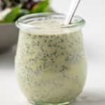Jar of creamy poppy seed dressing.