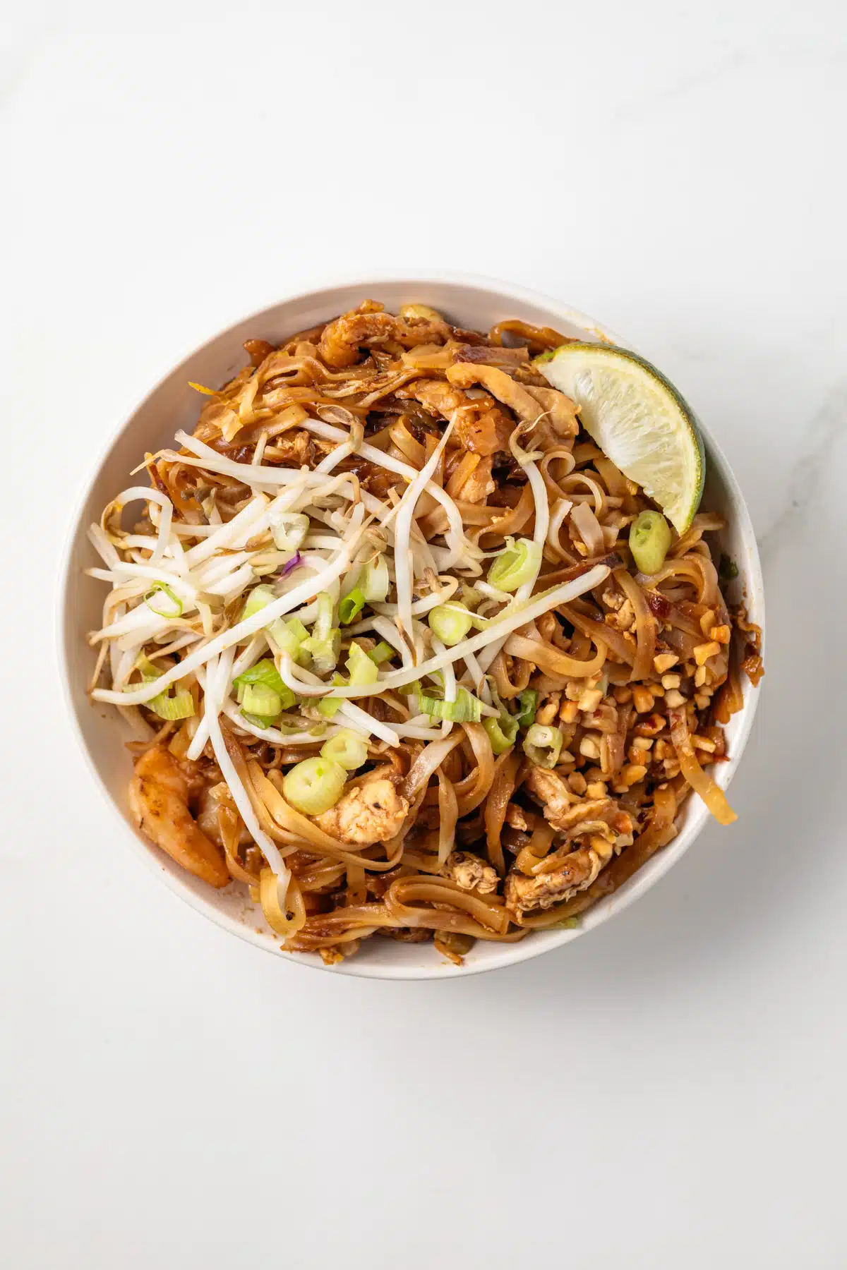 Overhead of Pad Thai in a white bowl.