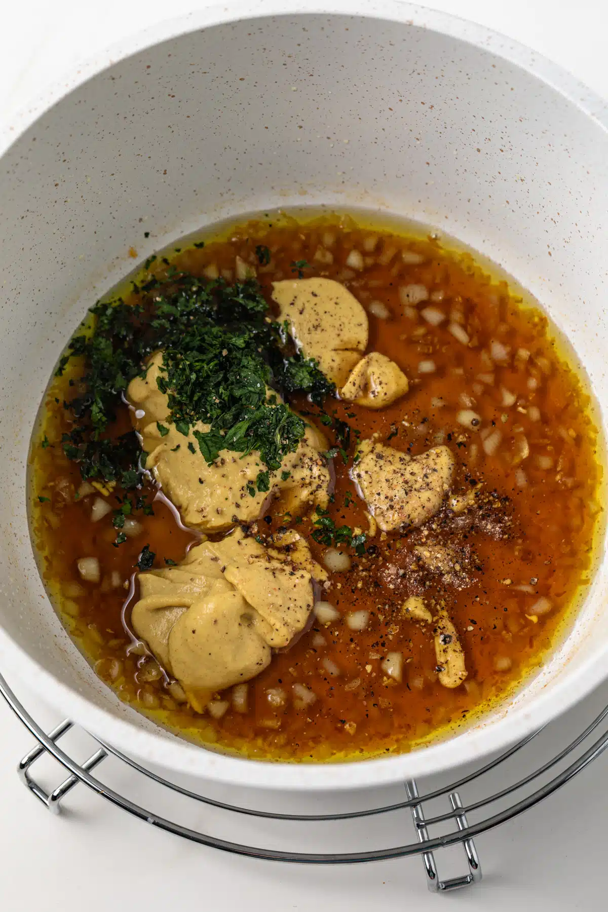 Maple, Dijon mustard, parsley in sauce pan.