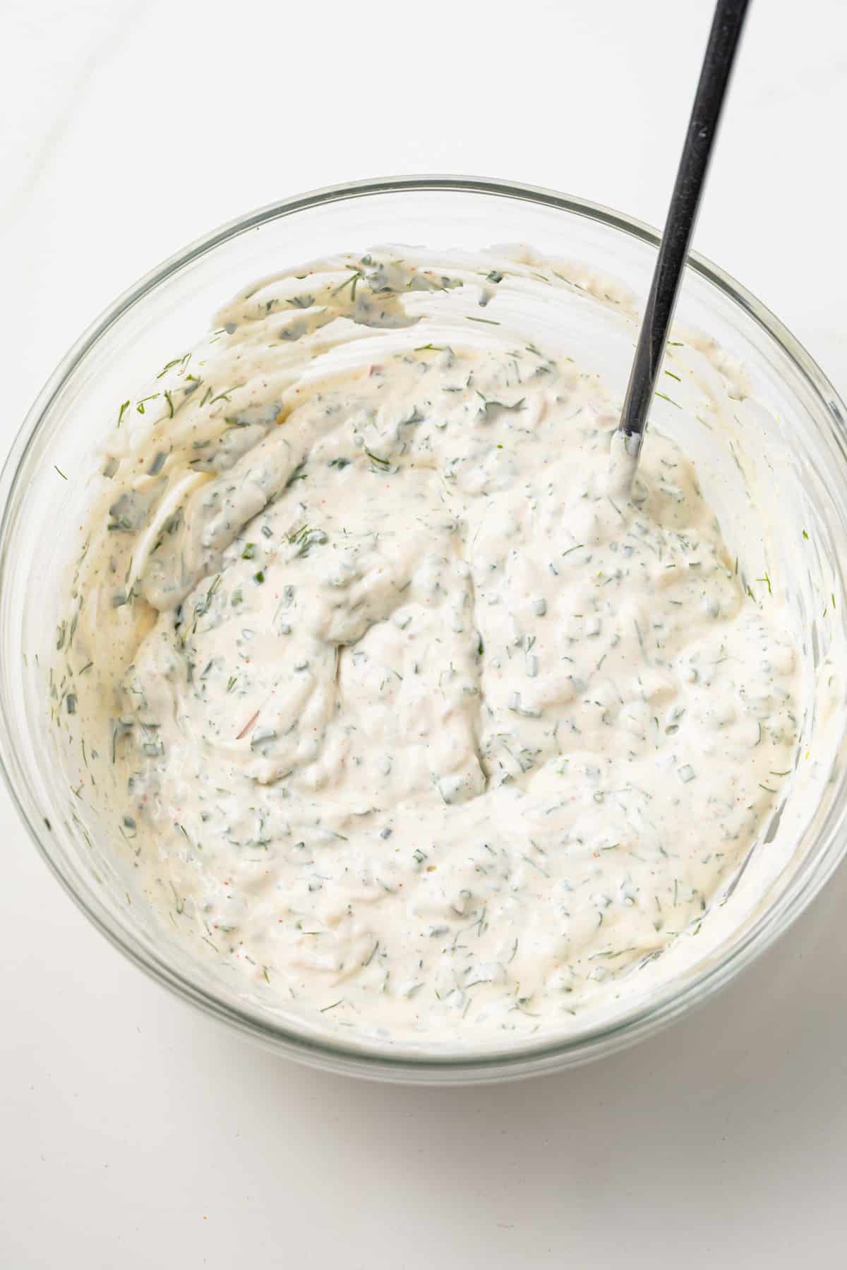Creamy herb sauce in a bowl.