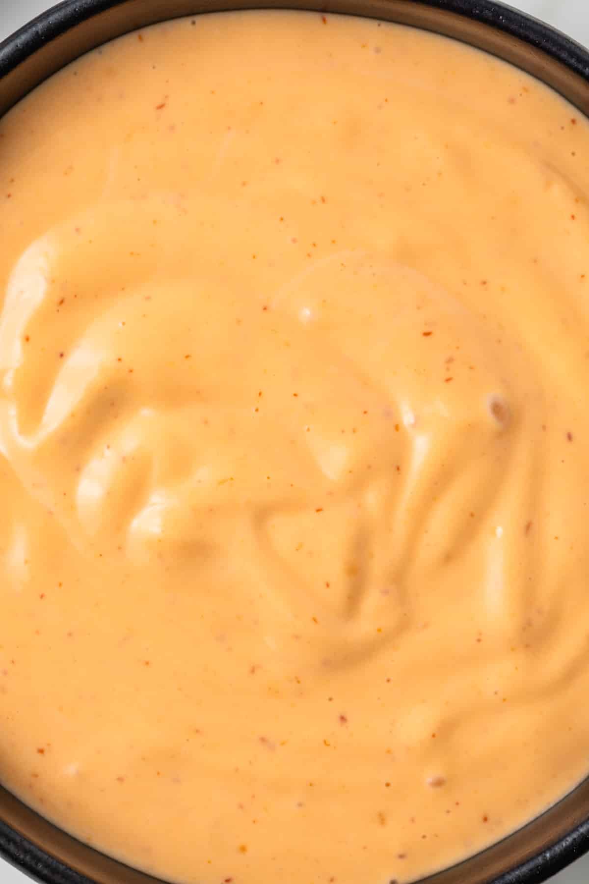 Close up of sriracha aioli in bowl.