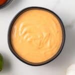 Overhead view of sriracha aioli in a bowl.