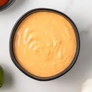 Overhead view of sriracha aioli in a bowl.