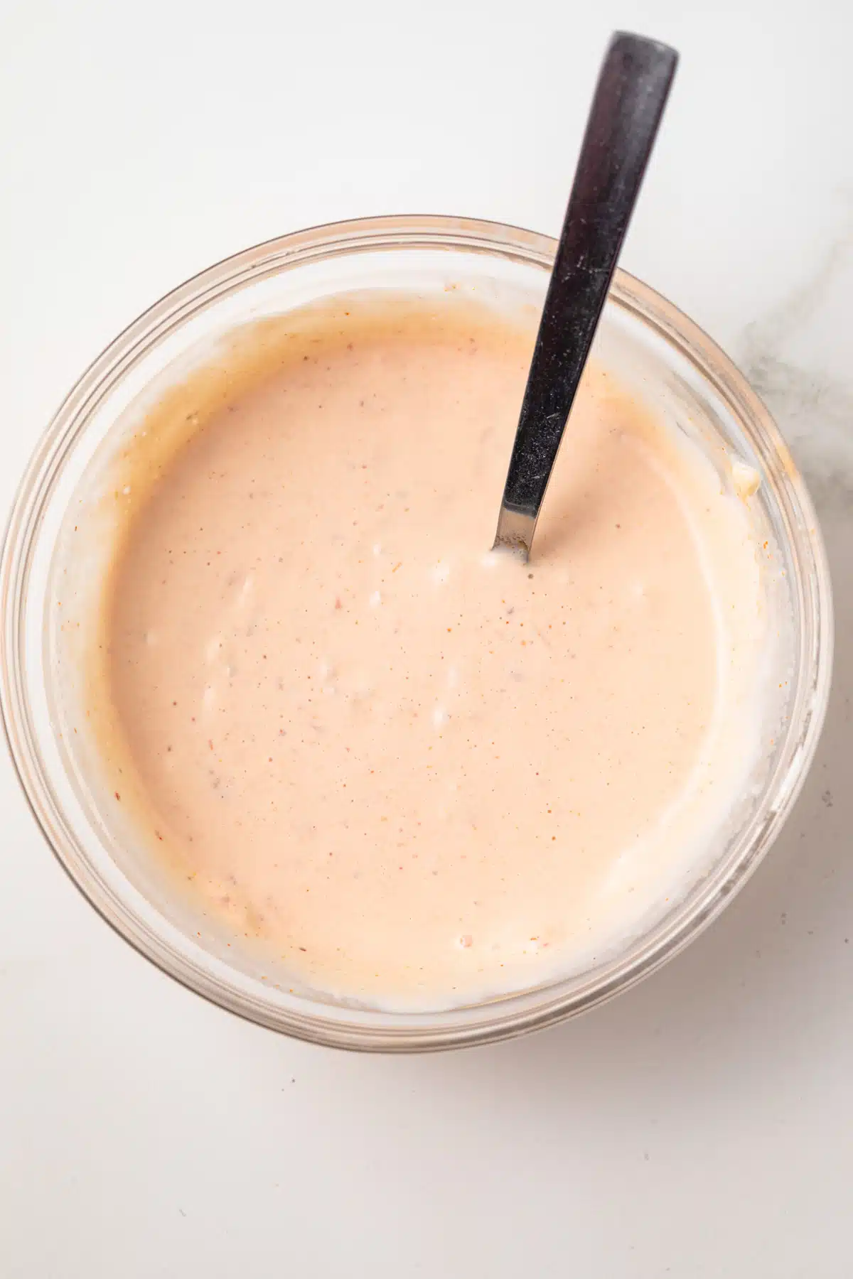 Chipotle aioli in a glass bowl.