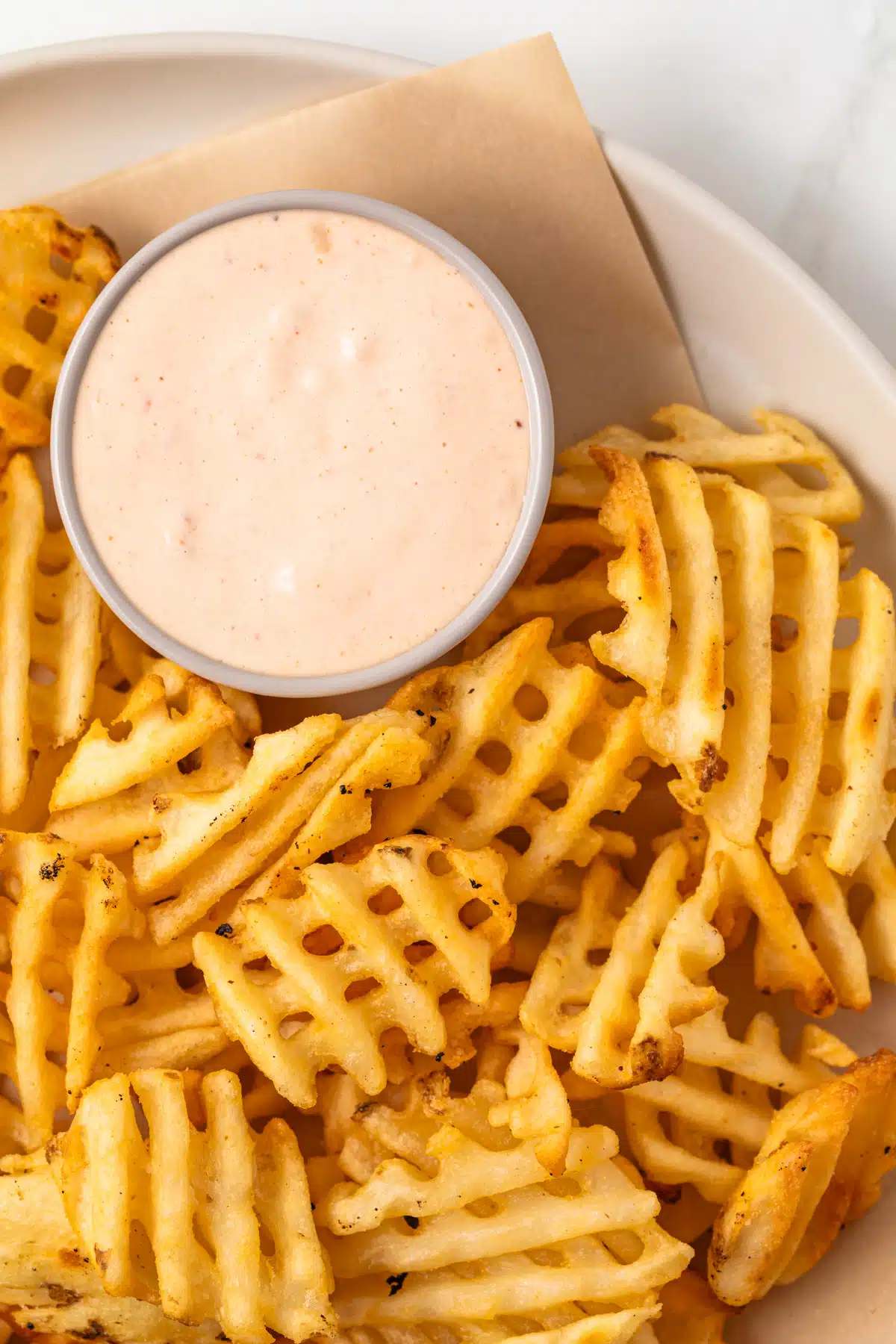 Chipotle aioli with waffle fries.