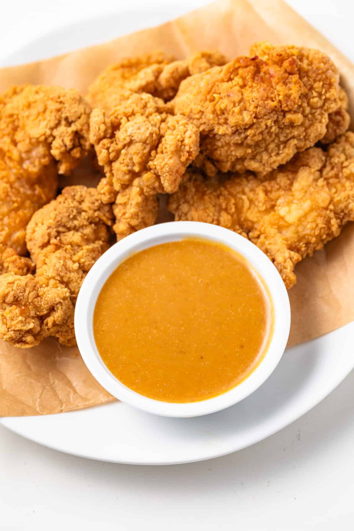 Chick Fil A sauce in a bowl with chicken tenders.
