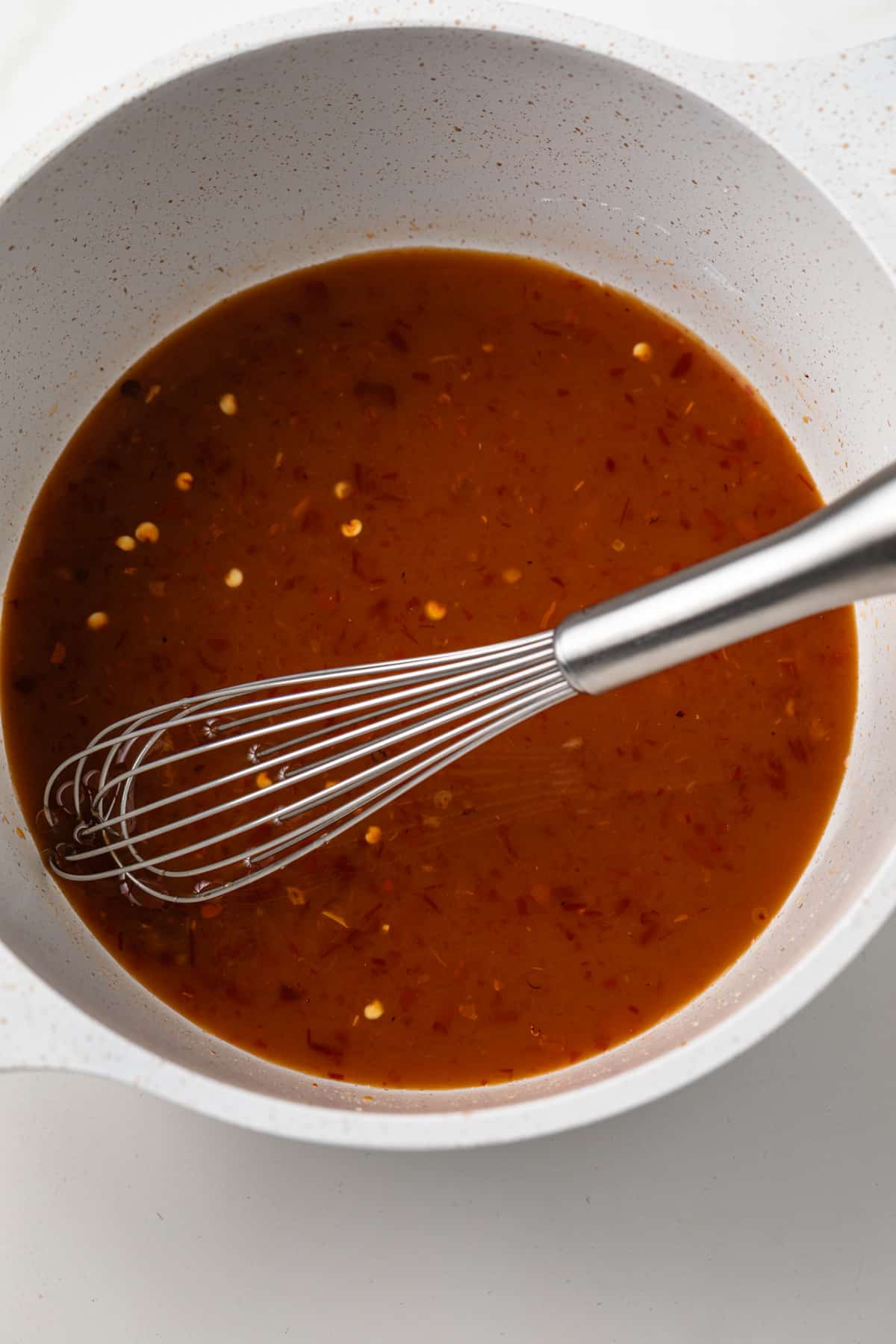 Ingredients for general tso sauce in a sauce pan.
