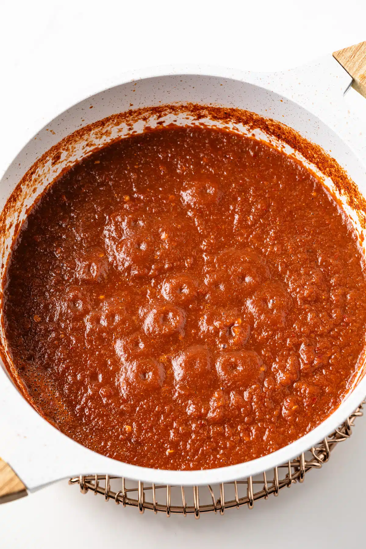 Cooked picante sauce in a saucepan.