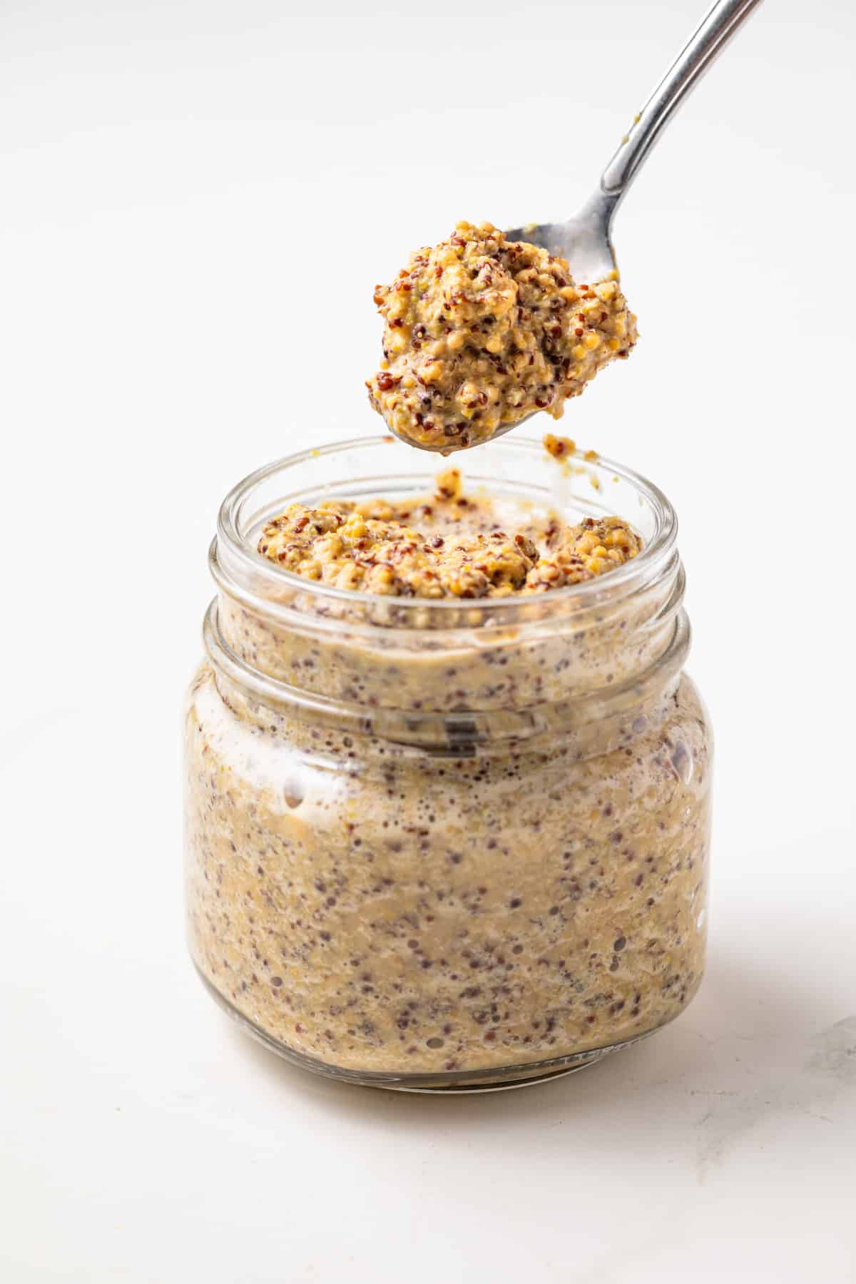 Homemade spicy mustard on a spoon.