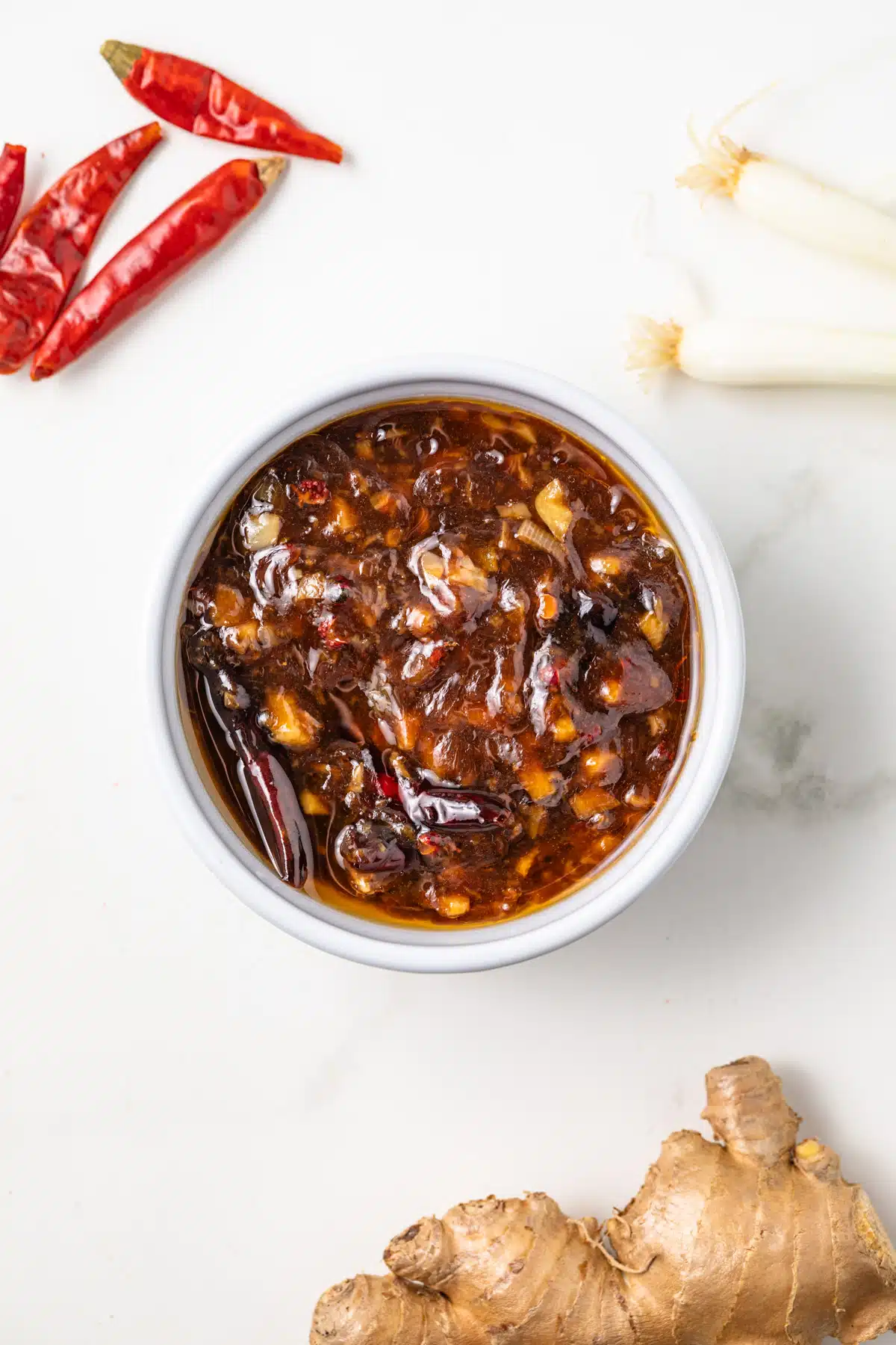 Overhead of Kung Pao Sauce in a white bowl.