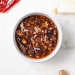 Overhead of Kung Pao Sauce in a white bowl.