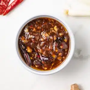 Overhead of Kung Pao Sauce in a white bowl.