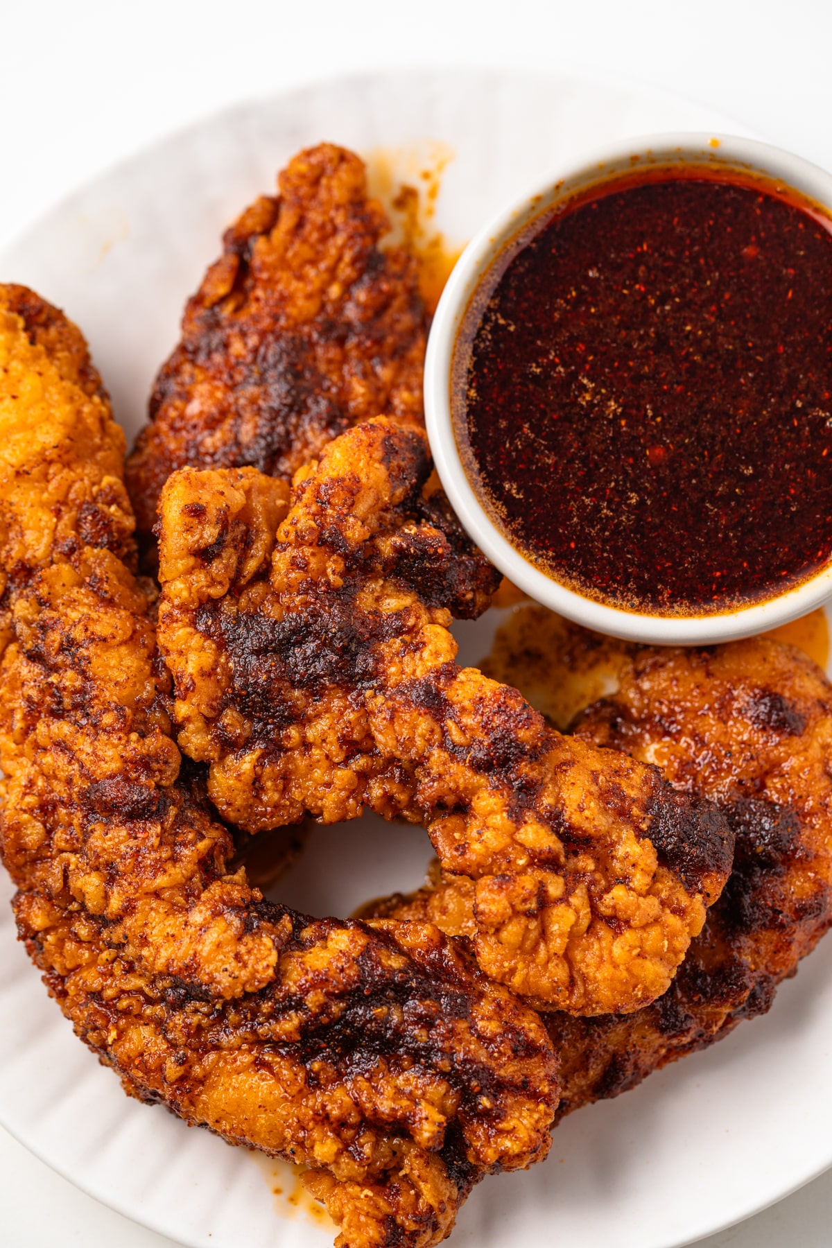 Chicken tenders coated in Nashville hot sauce.
