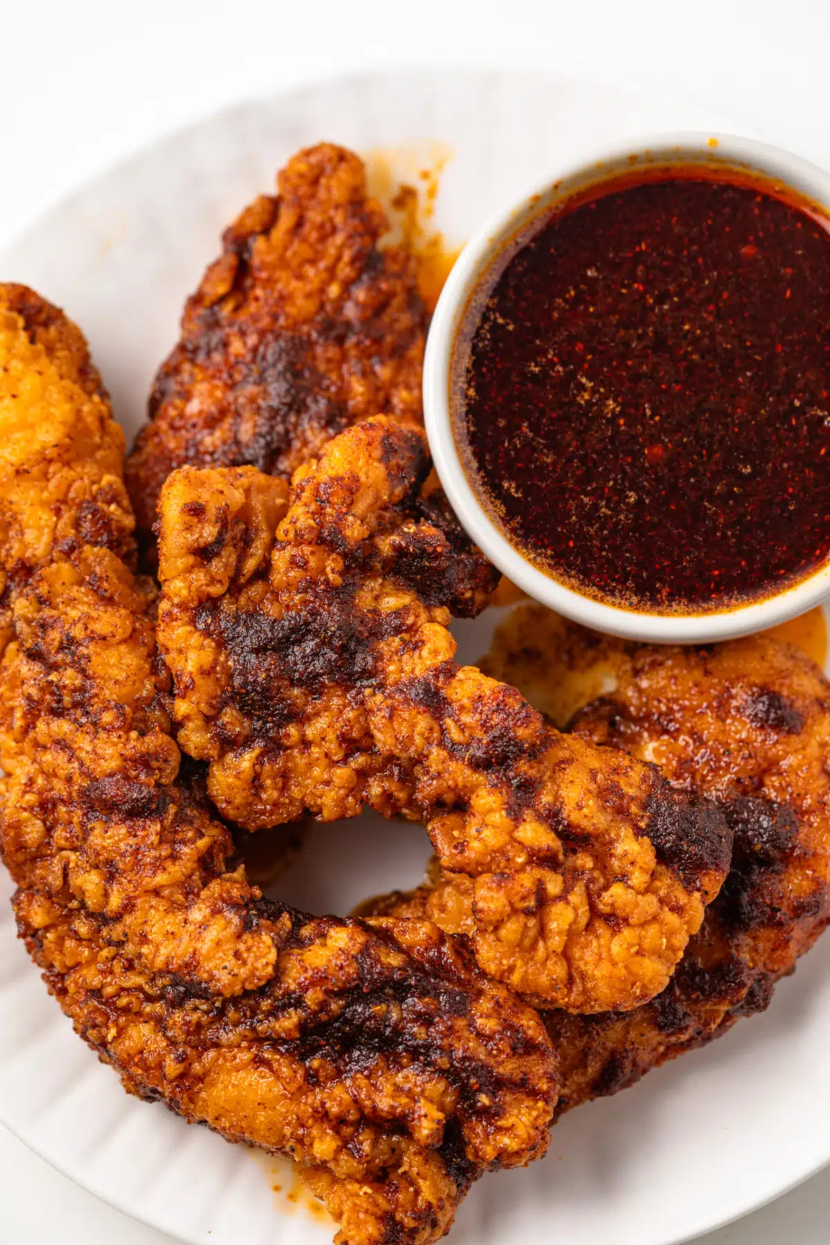 Chicken tenders coated in Nashville hot sauce.