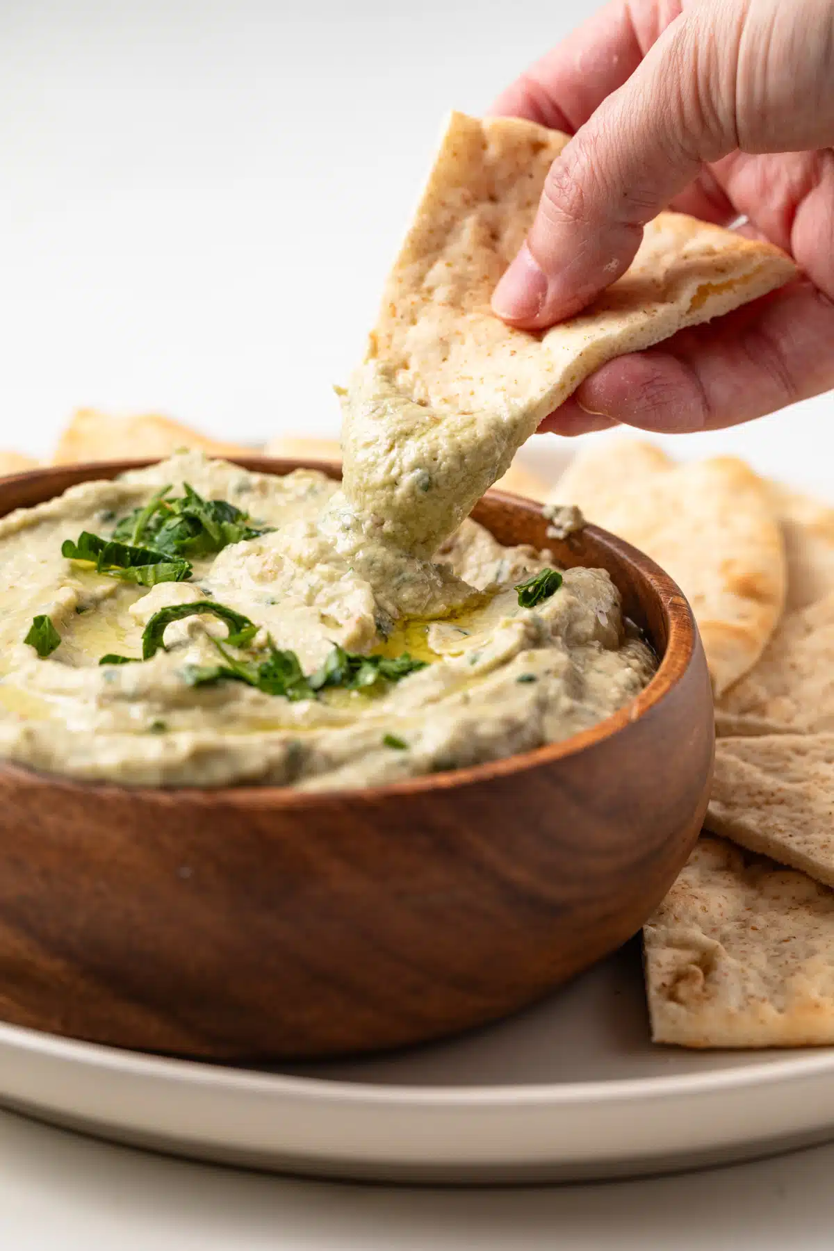 Pita bread dipped in baba ganoush.