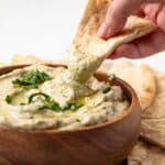 Pita bread dipped in baba ganoush.