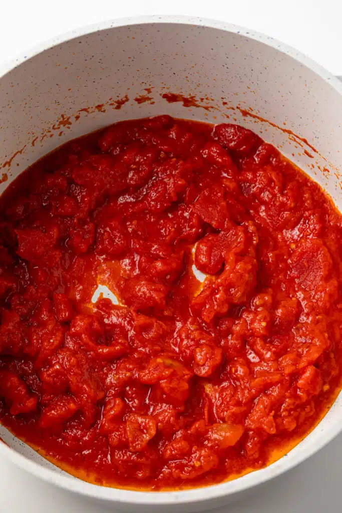 Butter roasted tomato sauce in a saucepan.