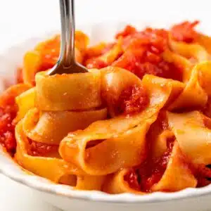 Pasta swirled on a fork.