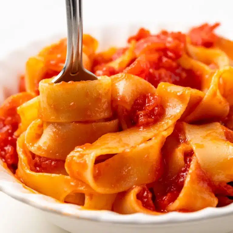 Pasta swirled on a fork.