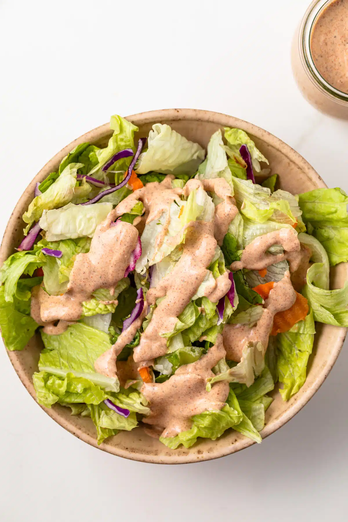 Salad topped with southwest salad dressing.