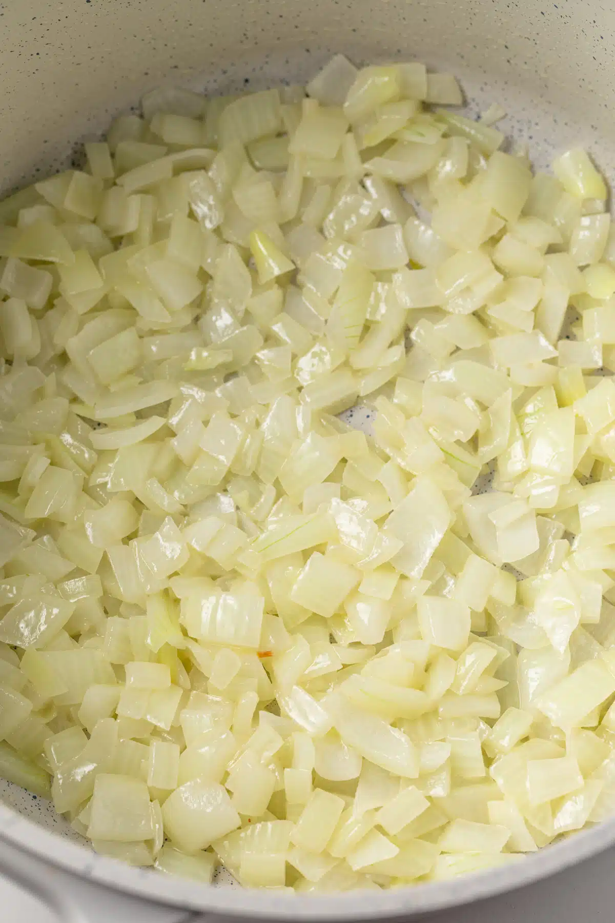 Sauteed onions in a pot.