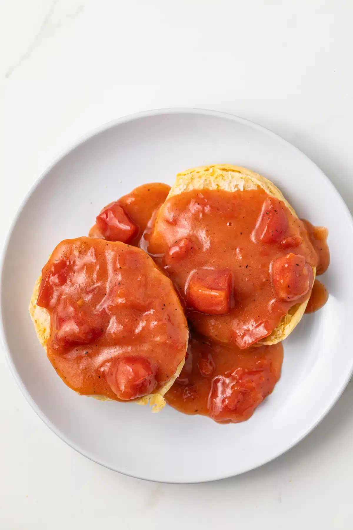 Over head of tomato gravy on a biscuit.