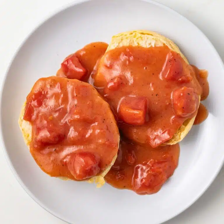 Over head of tomato gravy on a biscuit.