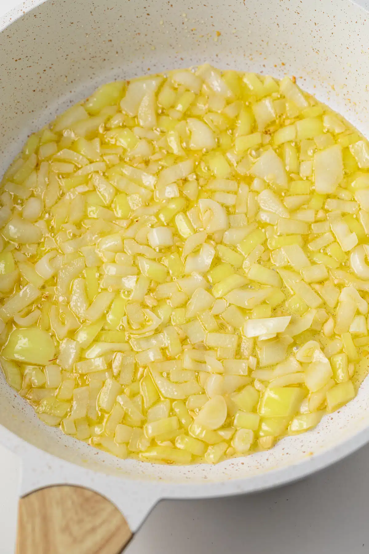 Sauteed onions and garlic in a pan.