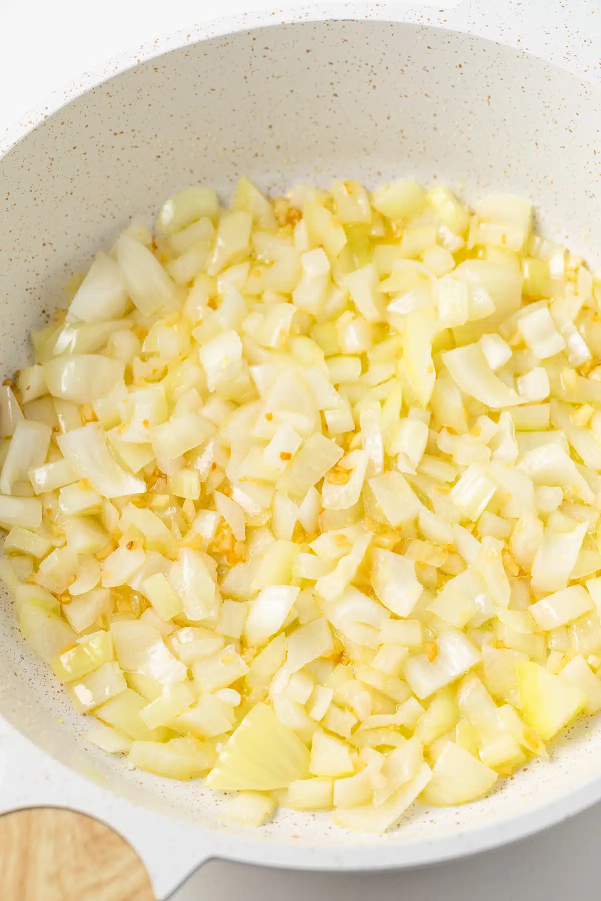 Sauteed onion and garlic in a fry pan.
