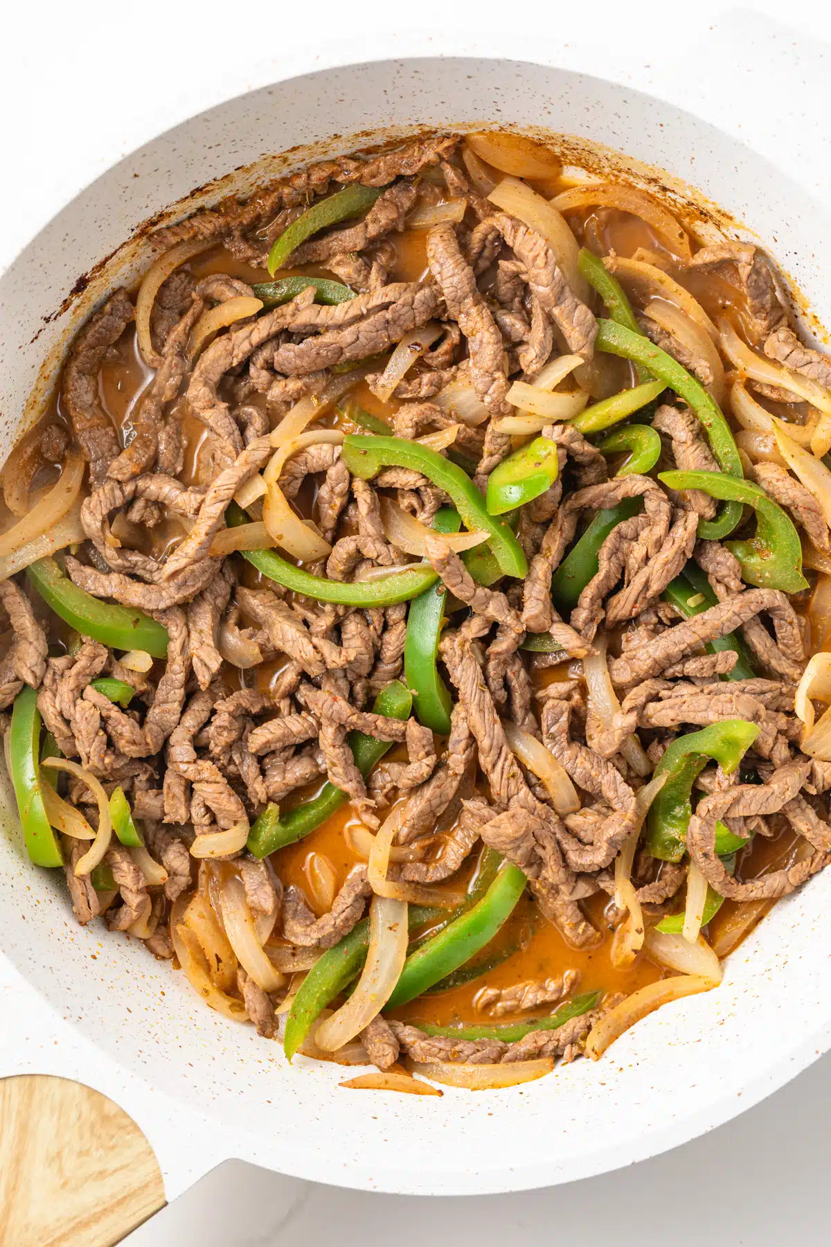 Homemade fajita sauce with meat and veggies.