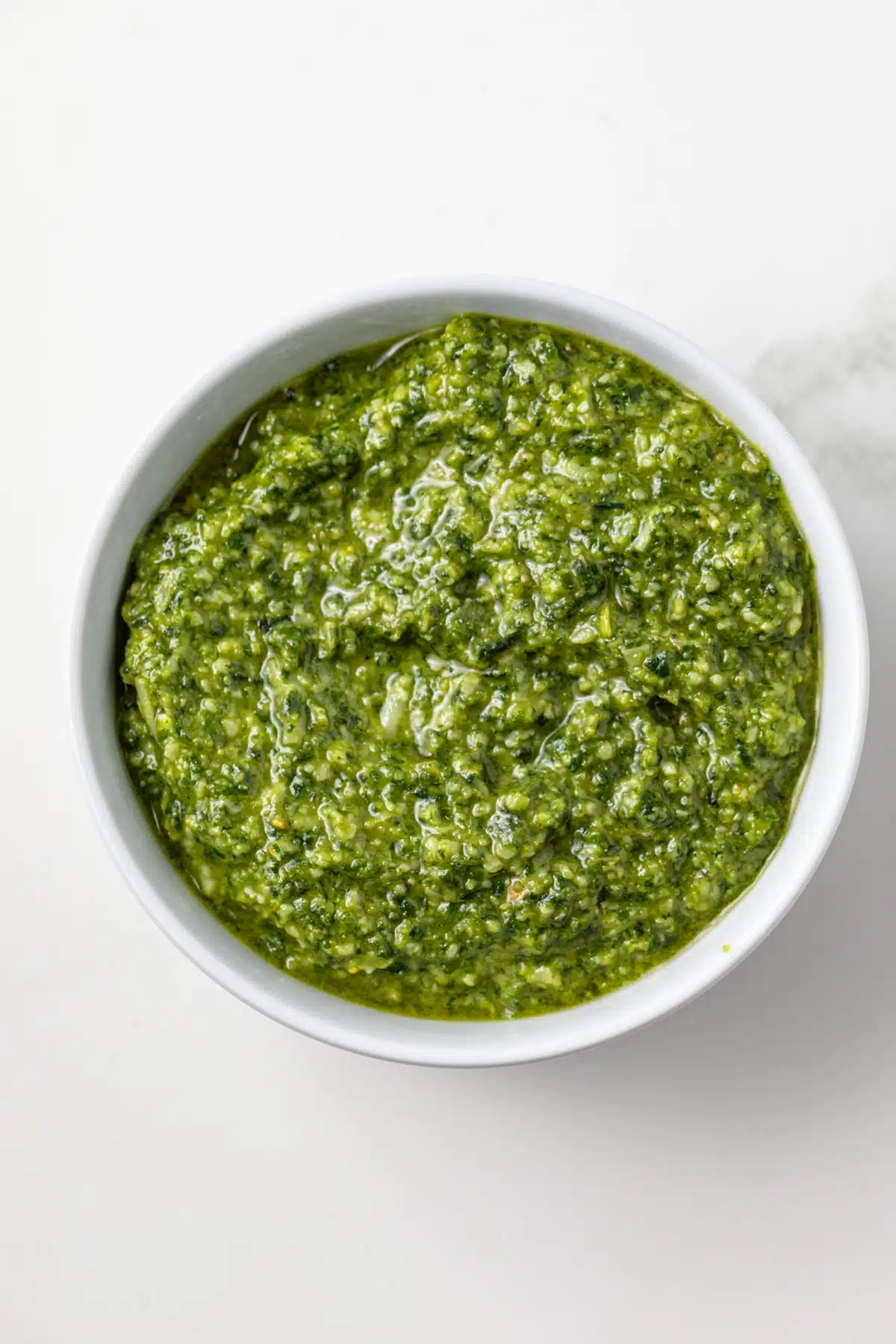 Pesto genovese in a white bowl.