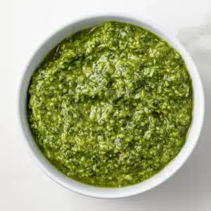 Pesto genovese in a white bowl.