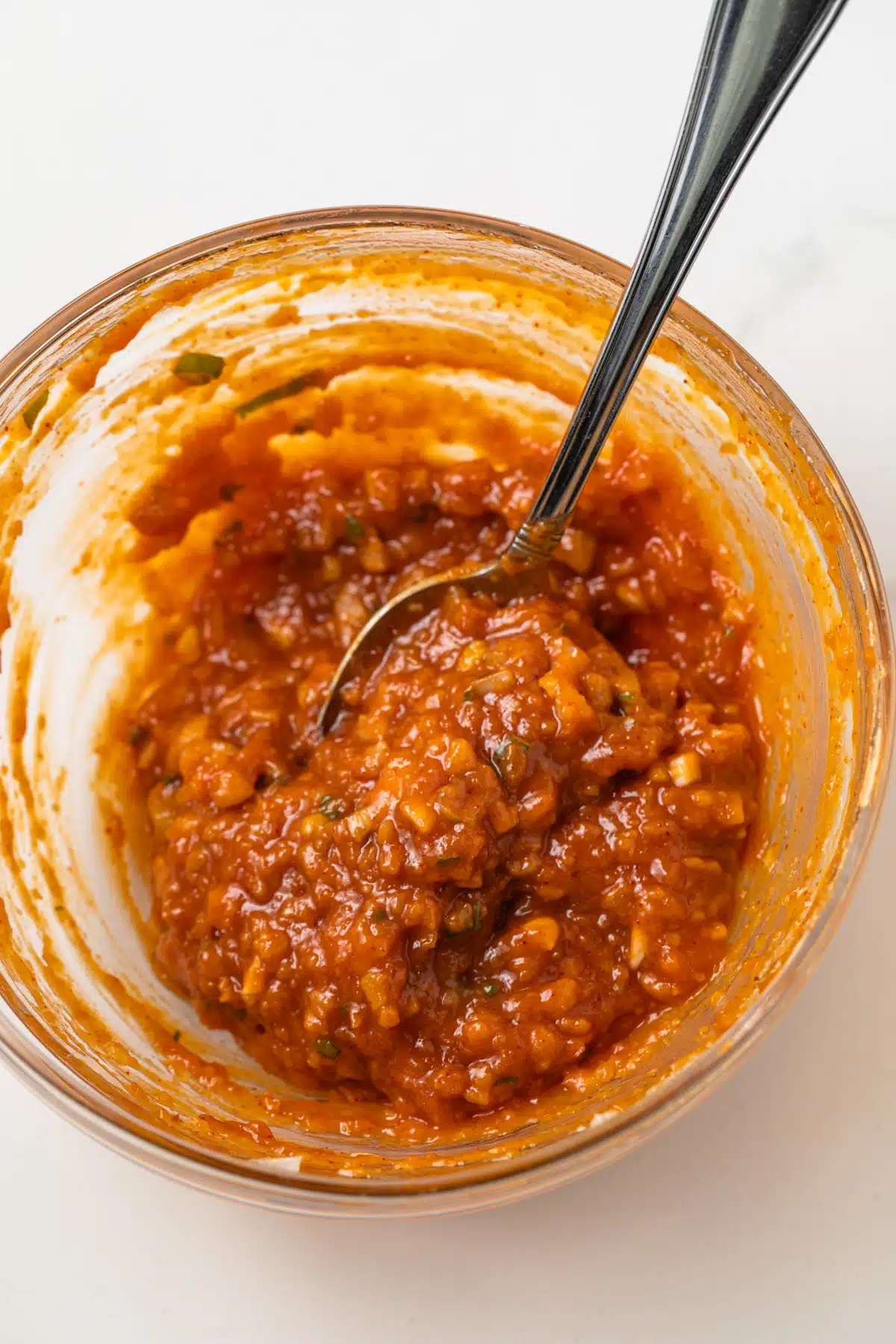 Ssamjang mixed in a glass bowl.