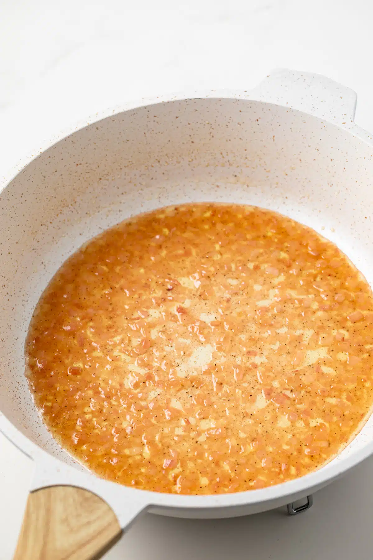 Reduced cooking wine in saucepan.