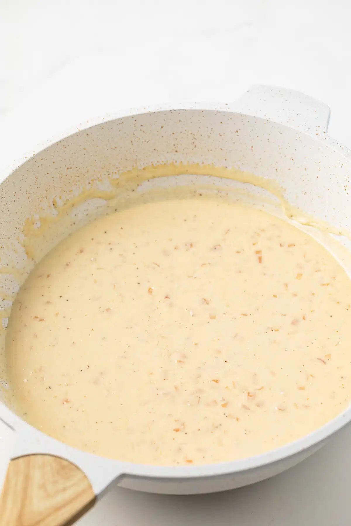 Sherry cream sauce in sauce pan.