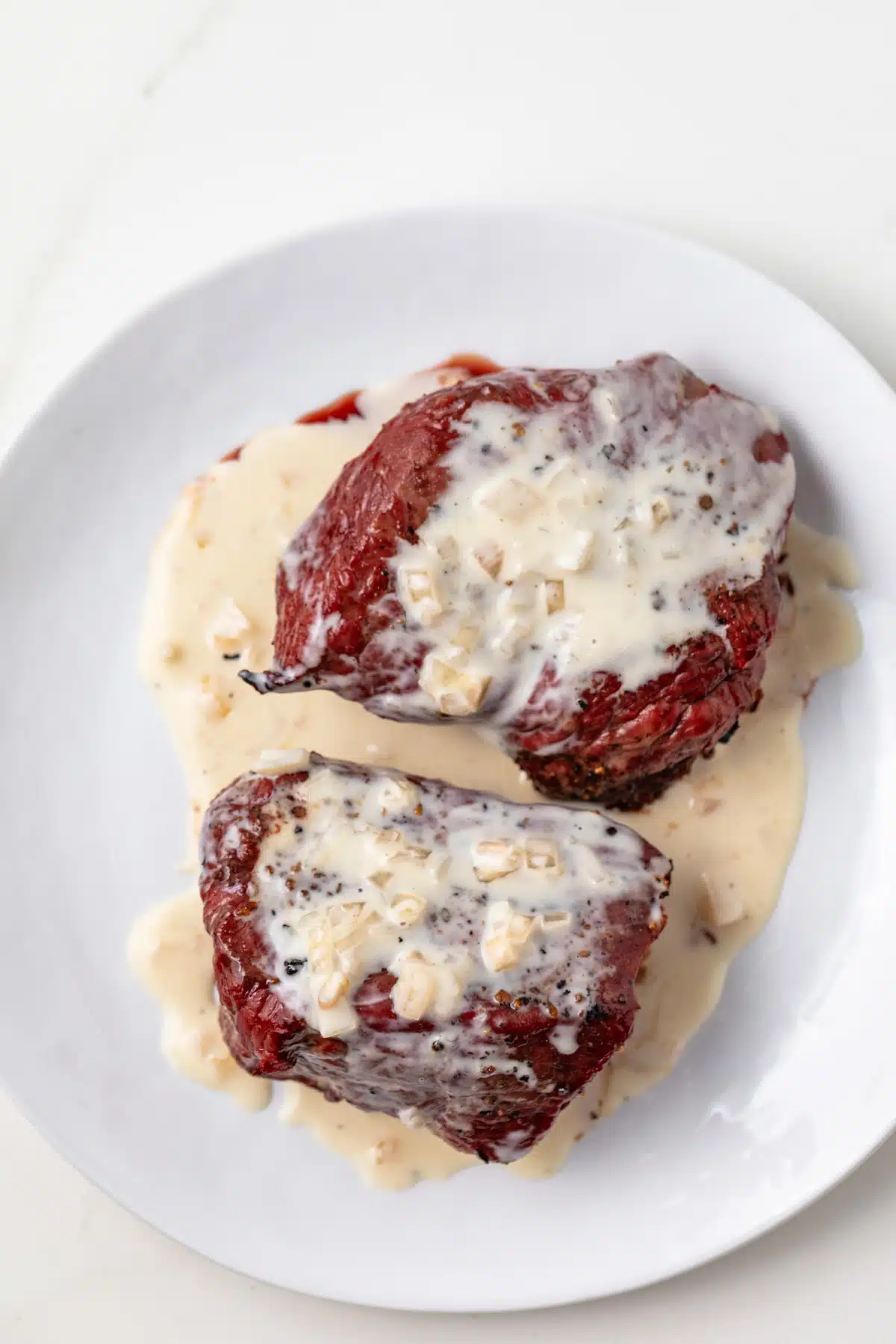 Sherry cream sauce over sirloin steaks.