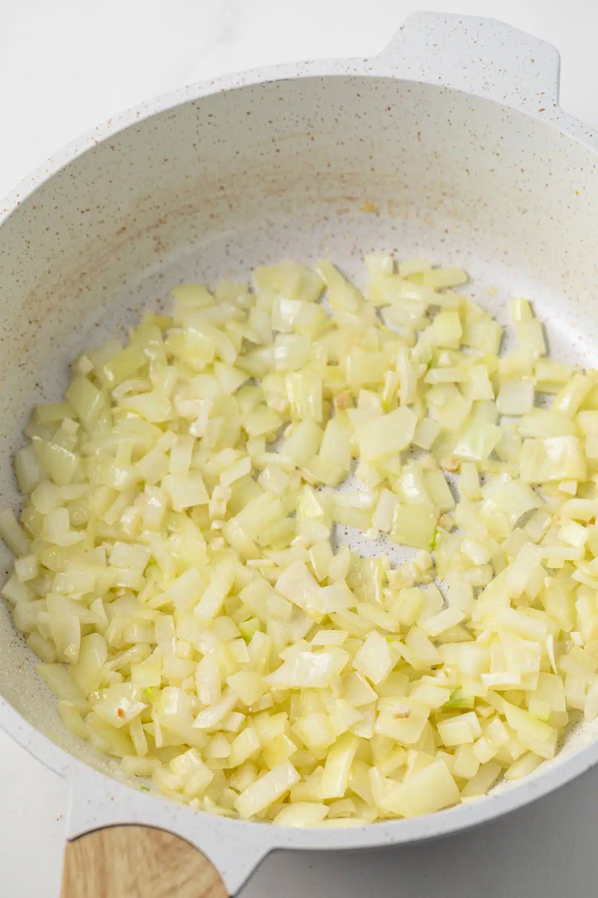 Sauteed onions and garlic in a saucepan.