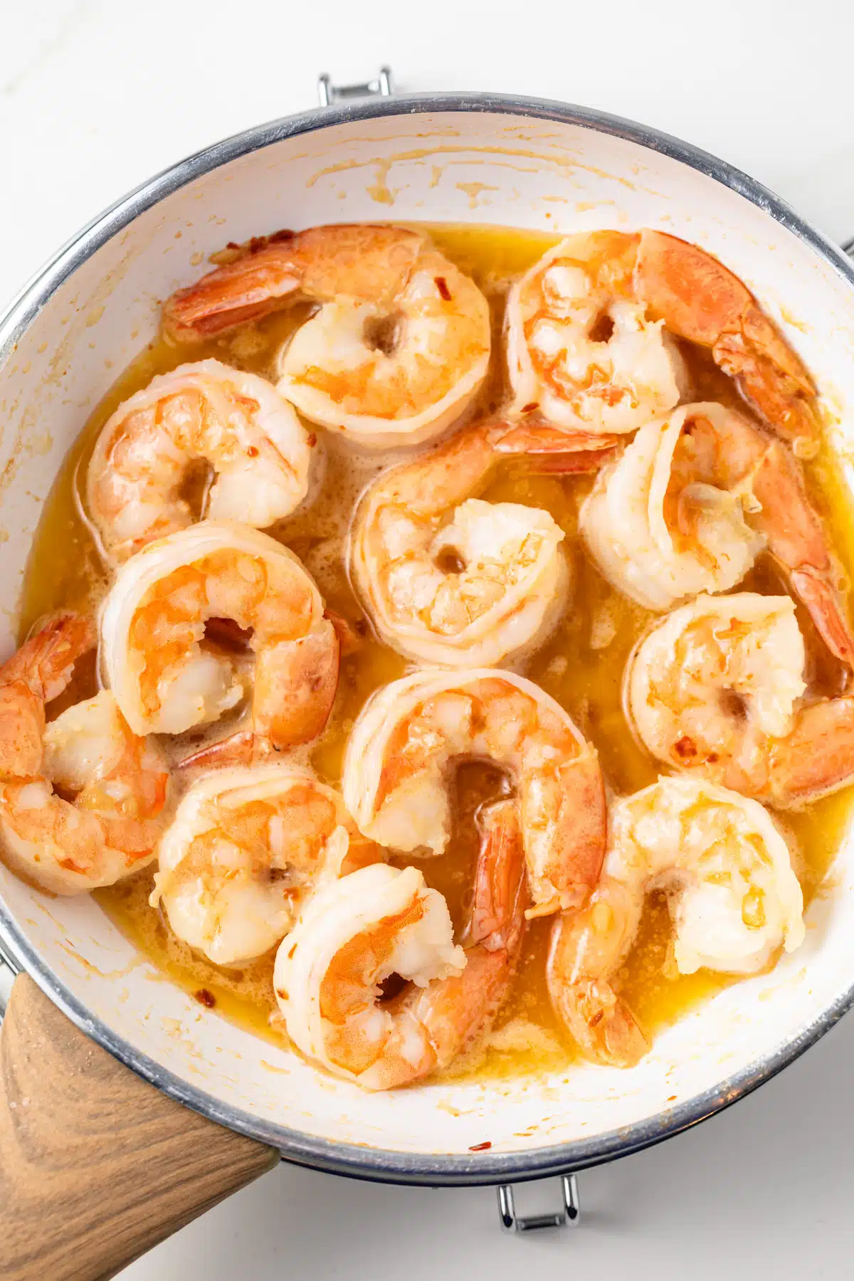 Shrimp scampi in a skillet.