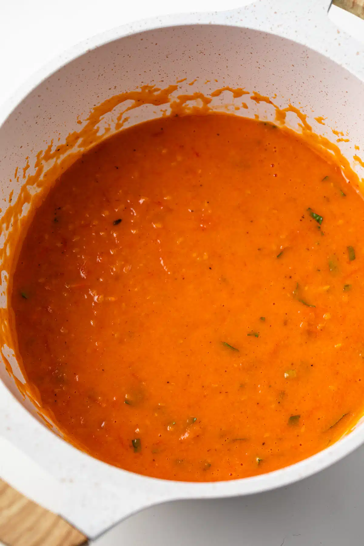 Roasted cherry tomato sauce in a sauce pan.